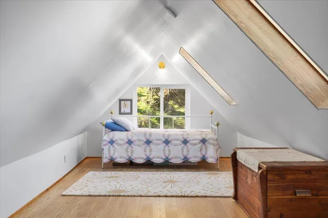 a view of a patio with table and chairs potted plants and a large tree