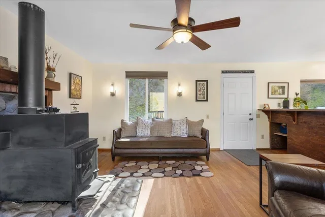 a kitchen with stainless steel appliances granite countertop hardwood a sink stove and refrigerator