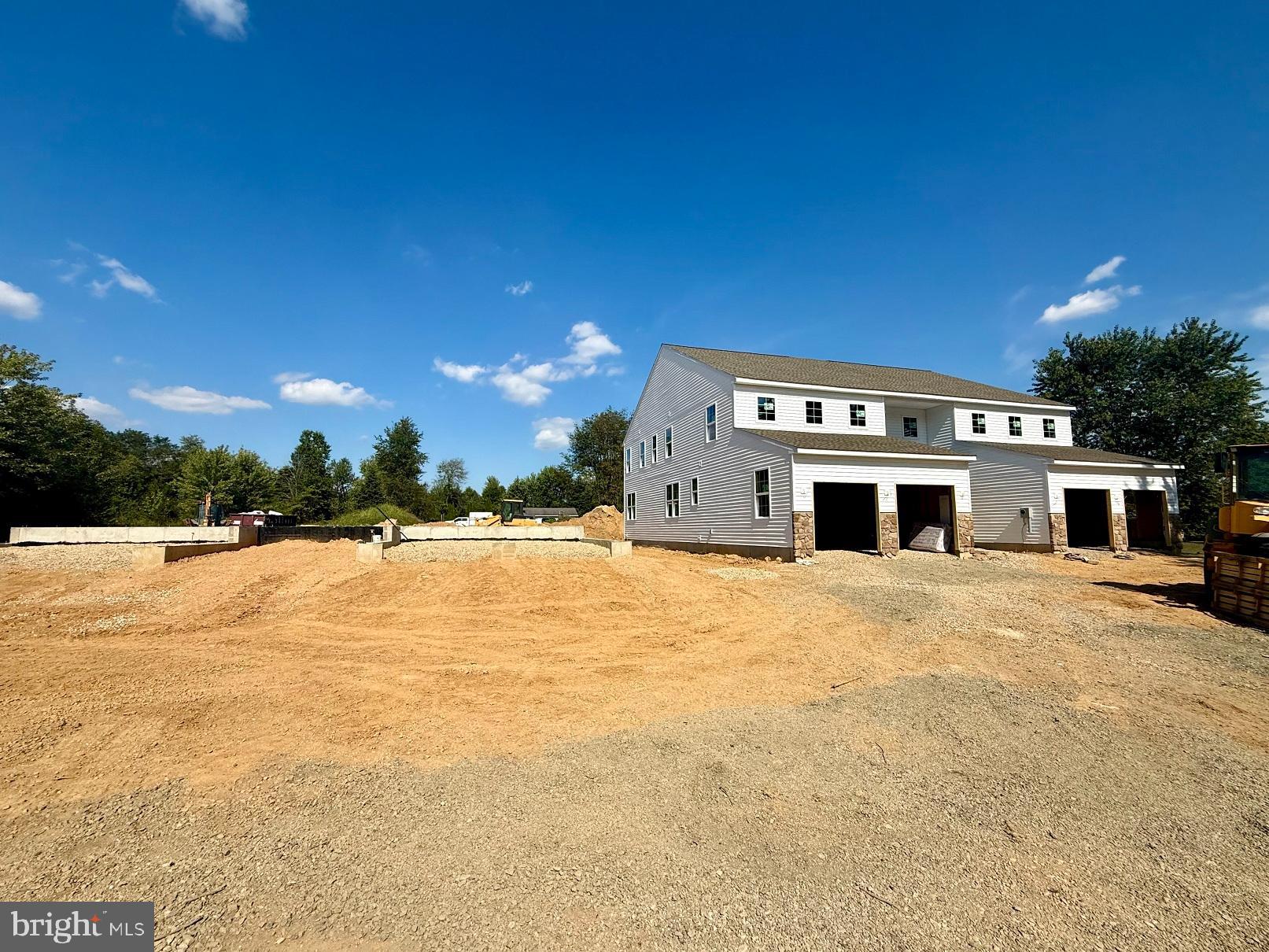 127 Stauffer Road Barto, PA 19504 - Photo 3 of 9 a view of a house with a yard and garage
