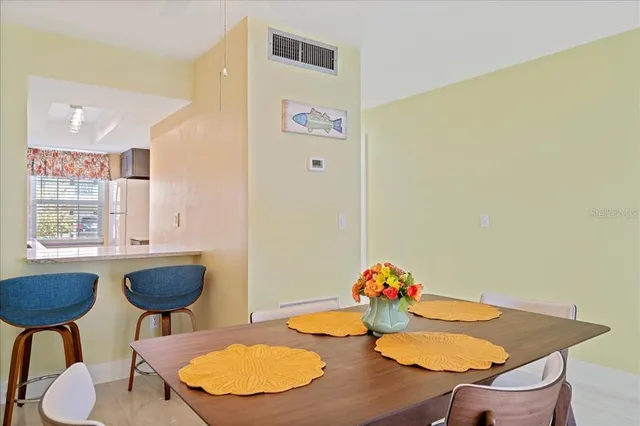 a kitchen with a table and chairs in it