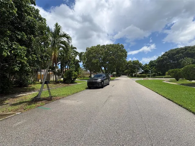 a view of street with parked cars