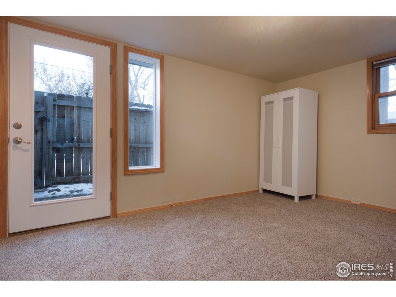 2535 Spruce Street Boulder, CO 80302 - Photo 17 of 17 a view of an empty room with a window and wooden floor