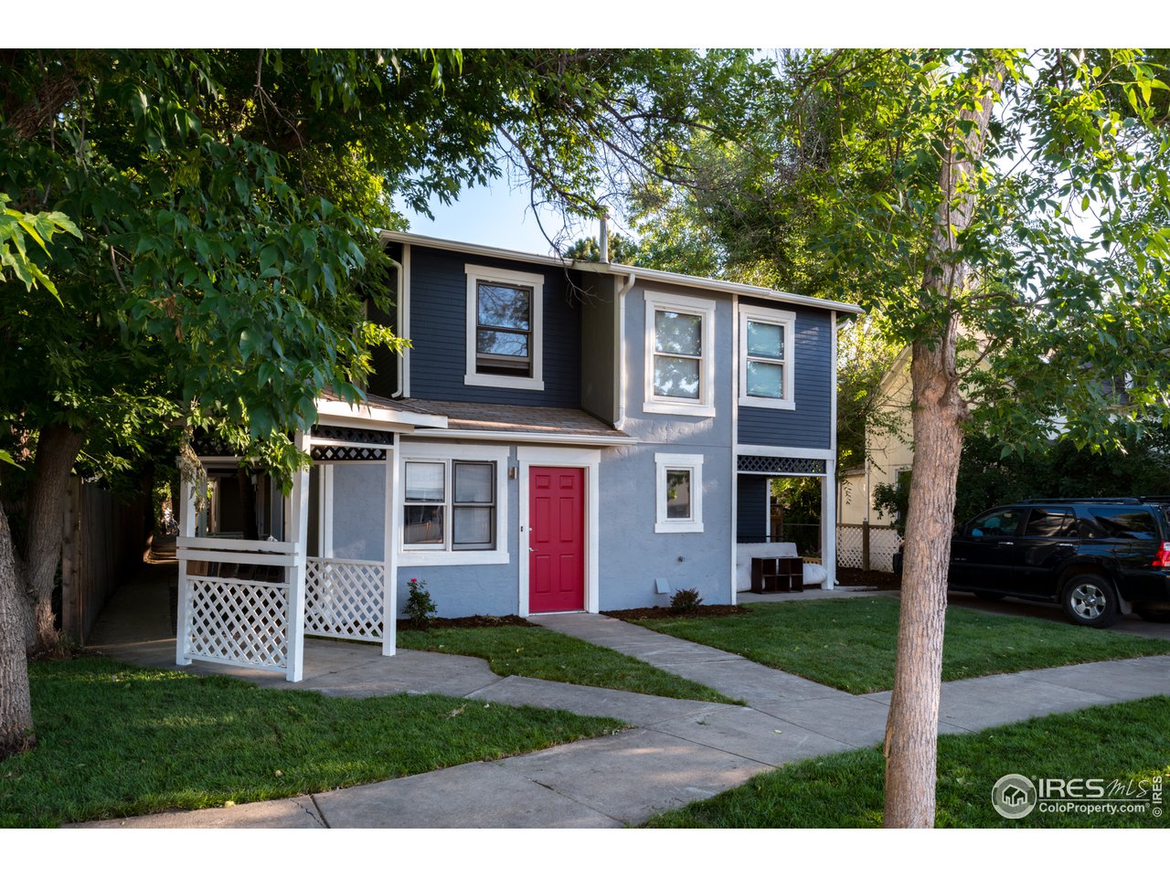 2535 Spruce Street Boulder, CO 80302 - Photo 3 of 17 a front view of a house with a yard