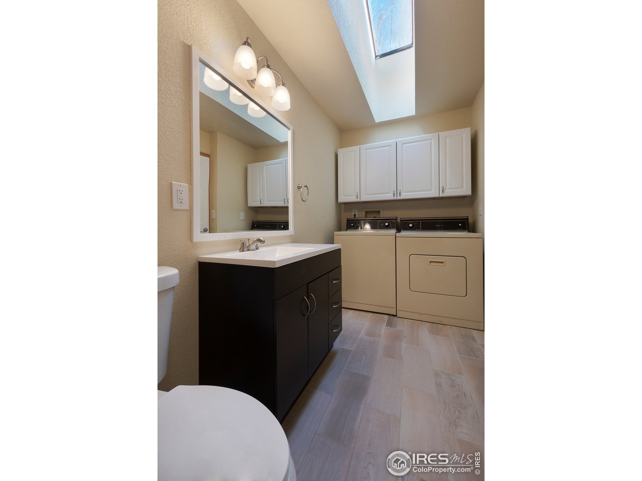 2535 Spruce Street Boulder, CO 80302 - Photo 7 of 17 a kitchen with a sink cabinets and a window