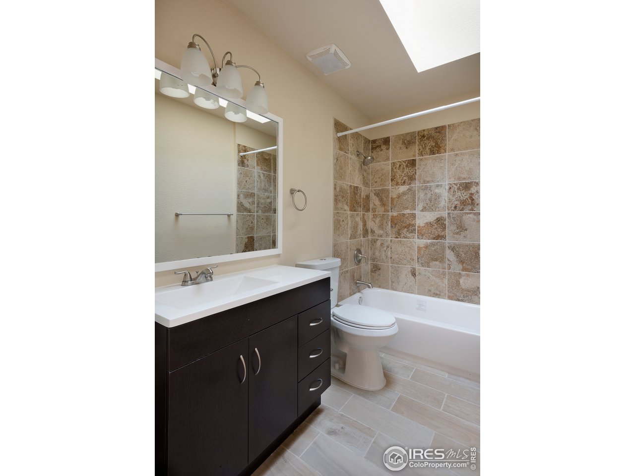 2535 Spruce Street Boulder, CO 80302 - Photo 9 of 17 a bathroom with a toilet a sink and mirror