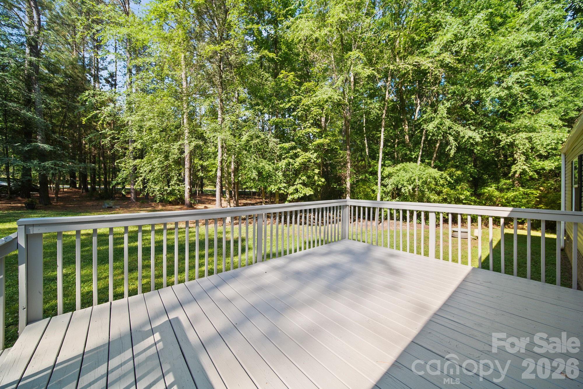 4507 White Store Road Wingate, NC 28174 - Photo 5 of 29 a view of a wooden deck