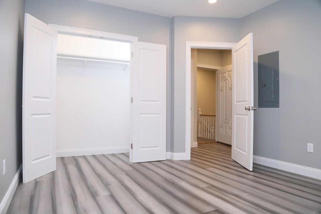 56 Byron Street, Unit 2 Boston, MA 02128 - Photo 14 of 17 wooden floor in an empty room