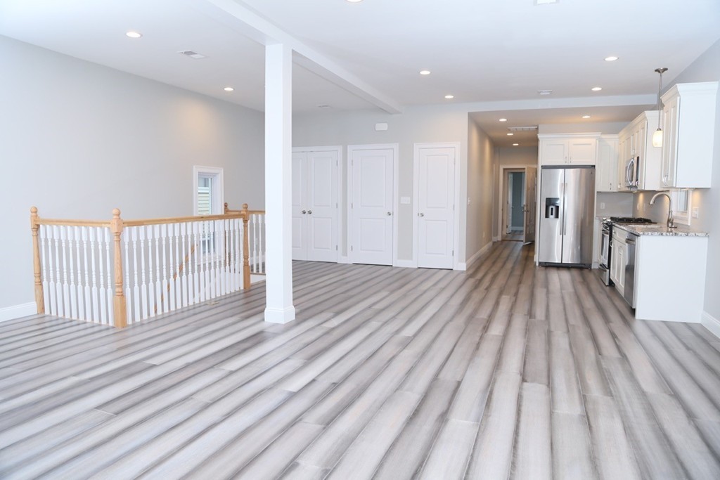 56 Byron Street, Unit 2 Boston, MA 02128 - Photo 4 of 17 a view of a room with wooden floor and windows