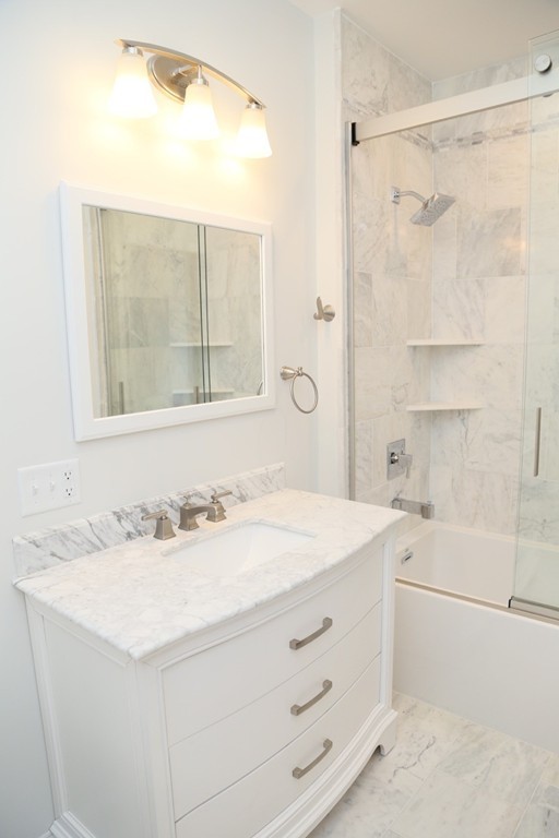 56 Byron Street, Unit 2 Boston, MA 02128 - Photo 7 of 17 a bathroom with a sink and a mirror