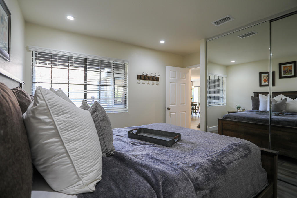 869 Congressional Road Simi Valley, CA 93065 - Photo 8 of 38 a bedroom with a bed and a large window