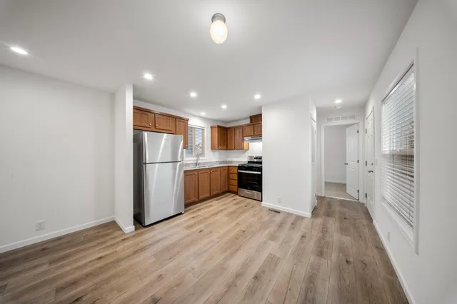a view of kitchen with wooden floor