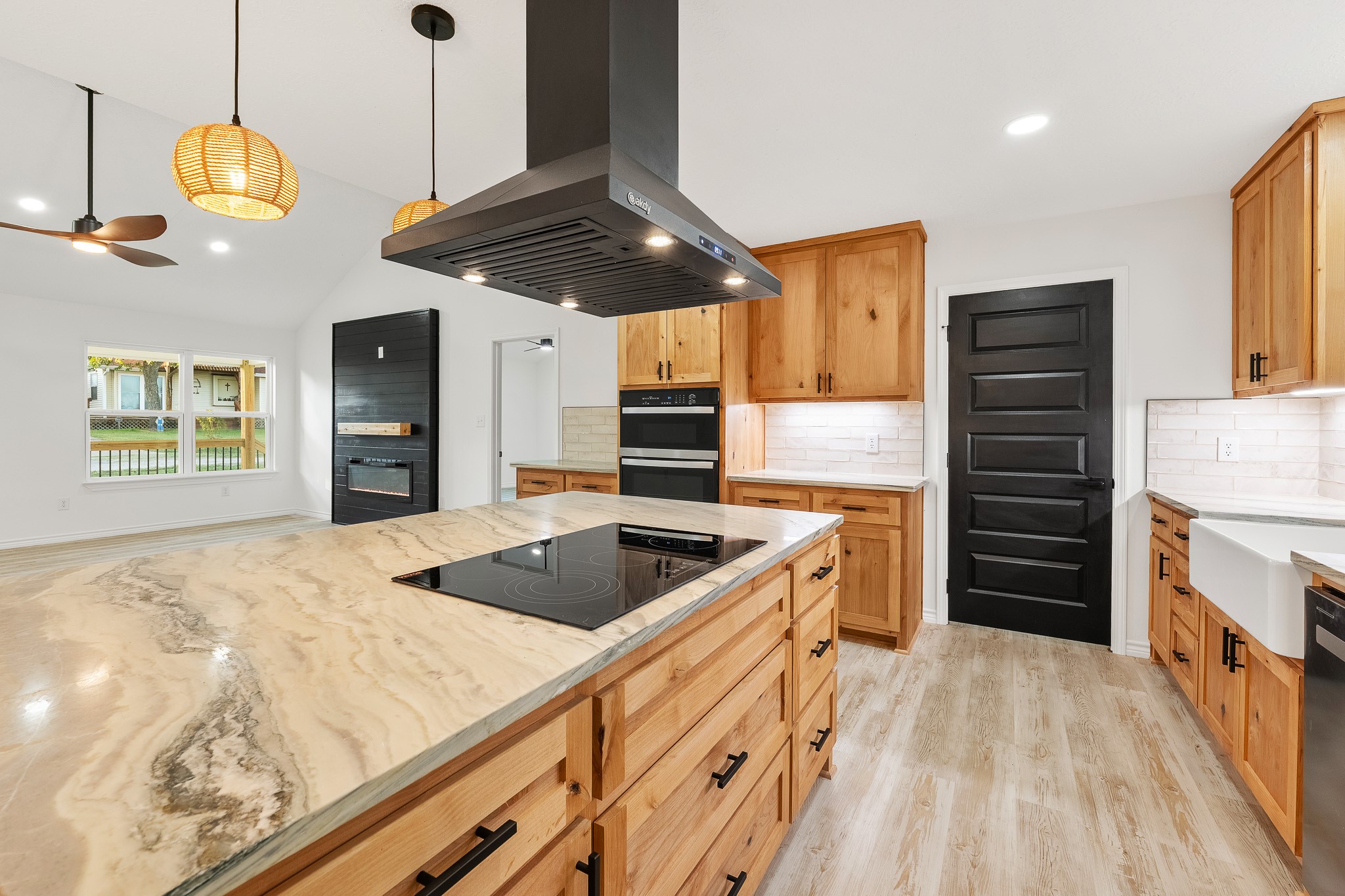 a kitchen with stainless steel appliances granite countertop a sink a stove and a refrigerator