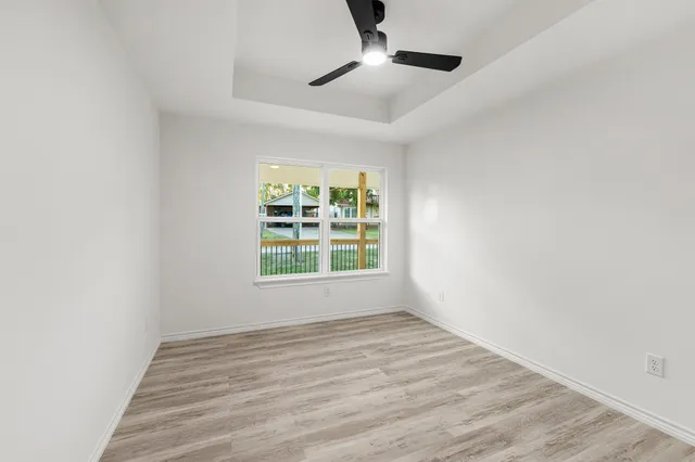 a bathroom with a granite countertop sink toilet a mirror and shower