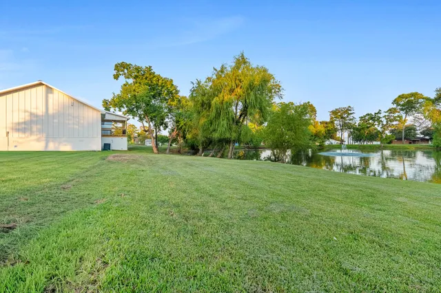 a view of a house with a yard and garage