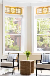 a living room with furniture and a window