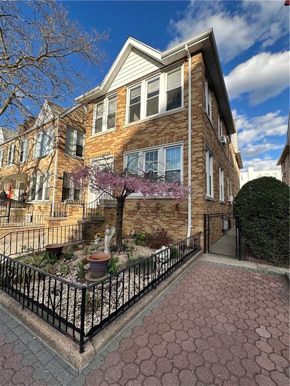 7021 Colonial Road Brooklyn, NY 11209 - Photo 2 of 15 a front view of a house with iron fence