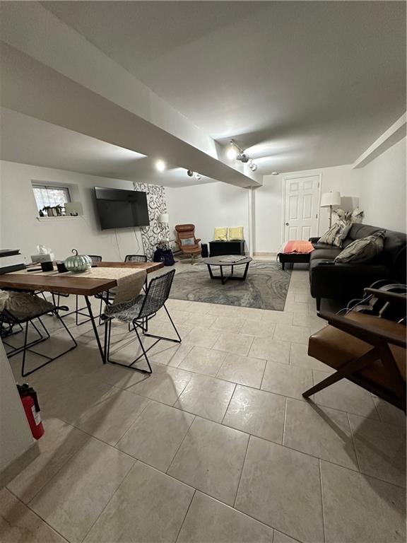 7021 Colonial Road Brooklyn, NY 11209 - Photo 10 of 15 a living room with furniture and a flat screen tv