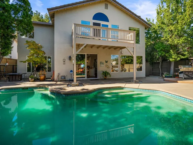 an aerial view of a houses with a yard