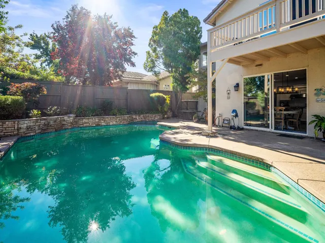 an aerial view of a houses with a yard
