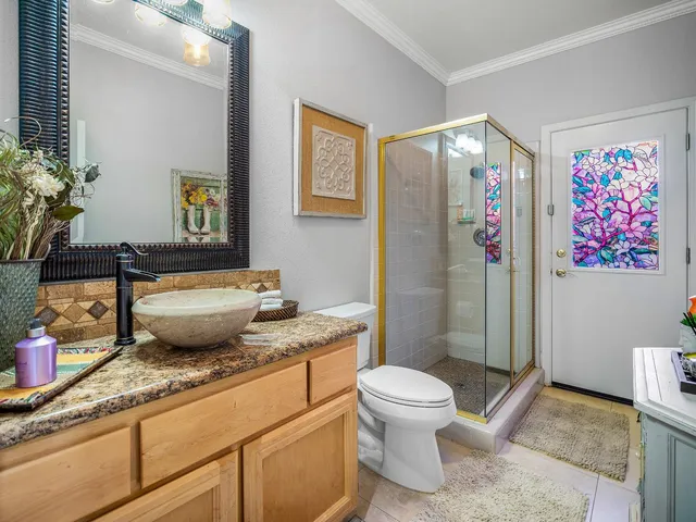 a bedroom with a bed and a dresser in it