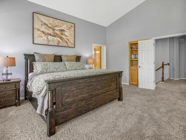 a spacious bathroom with a granite countertop tub sink and mirror