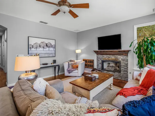 a kitchen with granite countertop a sink a counter top space appliances and cabinets