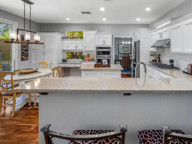 a view of a field with an trees