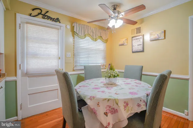 a kitchen with a refrigerator sink and cabinets