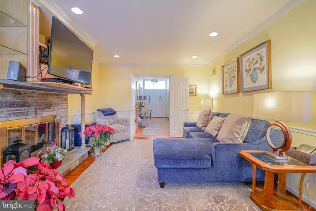 a view of a workspace with furniture and a book shelf