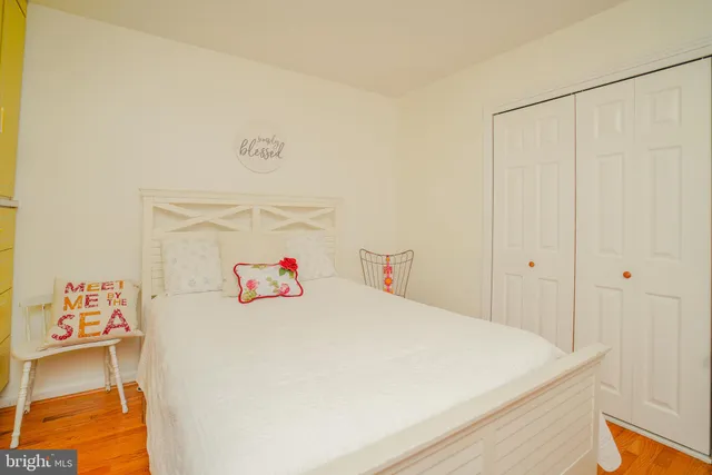 a view of a workspace with furniture and a bookshelf