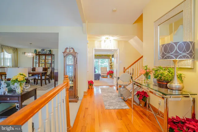 a bathroom with a granite countertop sink a toilet and a bathtub