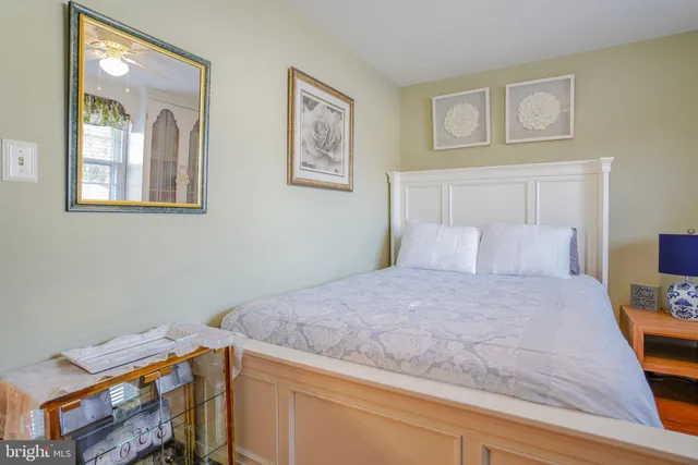 a bedroom with furniture and a book shelf