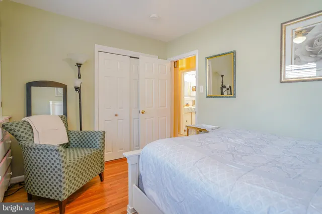 a bathroom with a toilet and a shower curtain