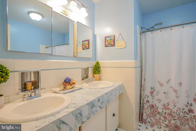 a bathroom with a sink a toilet and bathtub