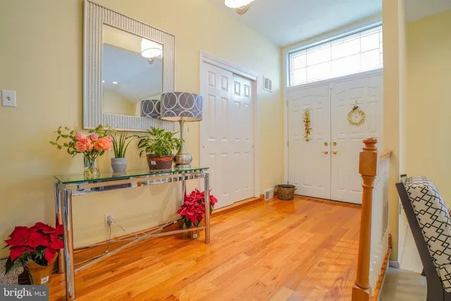 a very nice looking room with a dining table a chandelier