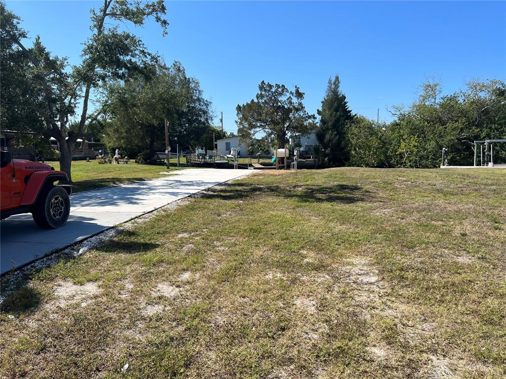 6836 Sea Ranch Drive Hudson, FL 34667 - Photo 2 of 10 a view of a yard with swimming pool