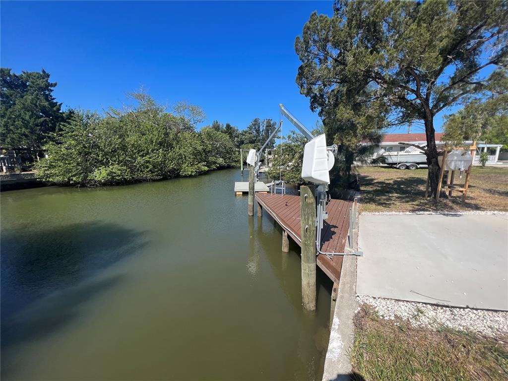 6836 Sea Ranch Drive Hudson, FL 34667 - Photo 3 of 10 a view of a lake with houses