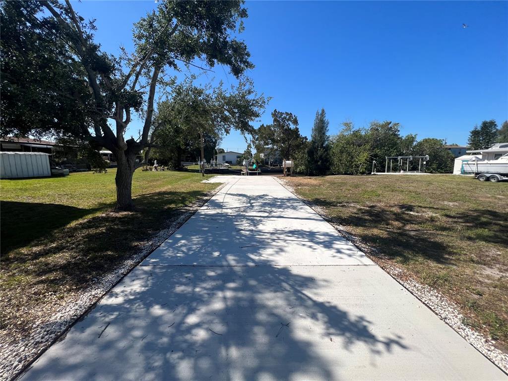 6836 Sea Ranch Drive Hudson, FL 34667 - Photo 8 of 10 a view of a yard with plants and trees