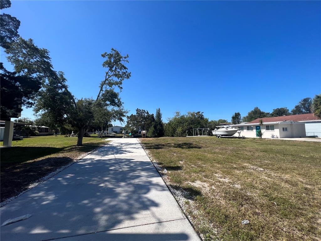6836 Sea Ranch Drive Hudson, FL 34667 - Photo 9 of 10 a view of a yard with a house