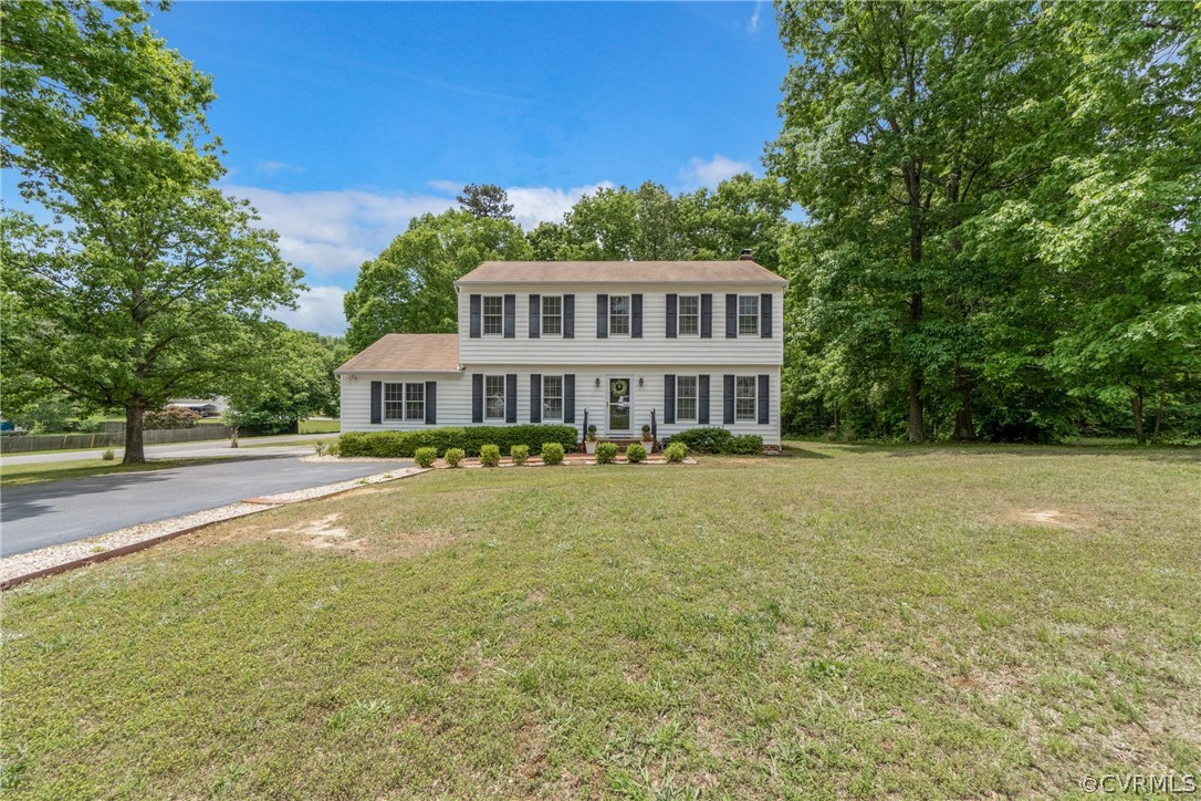 2617 Lampworth Road Henrico, VA 23231 - Photo 4 of 45 a front view of a house with a garden