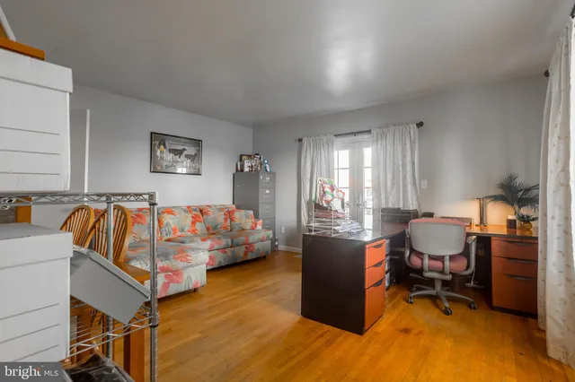 a kitchen with stainless steel appliances granite countertop a sink a stove a refrigerator and cabinets