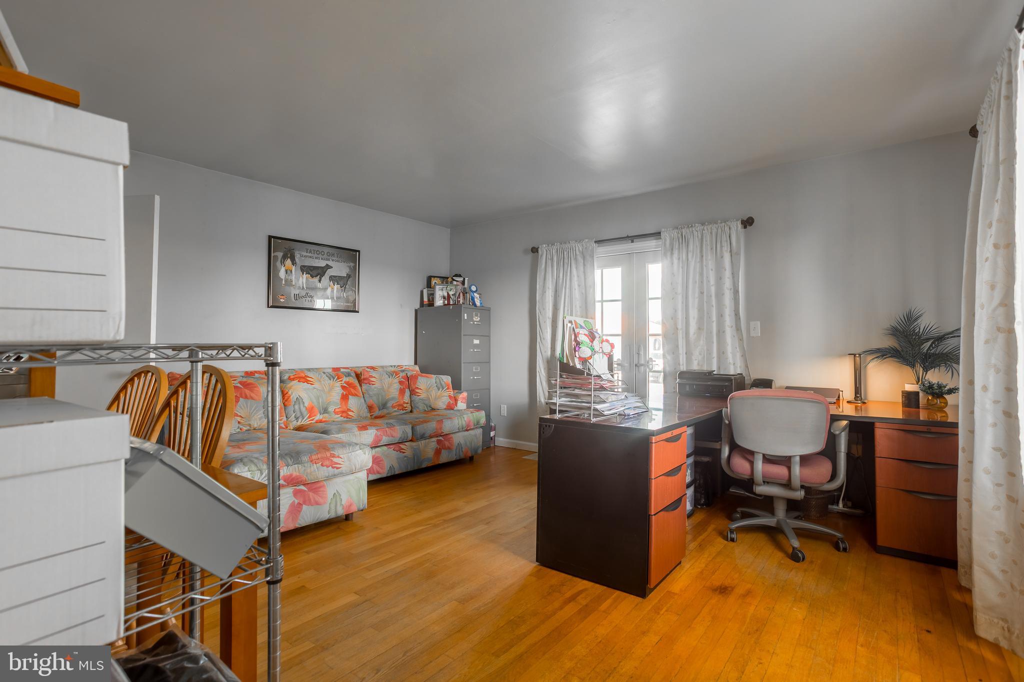 10380 Chapel Road Easton, MD 21601 - Photo 17 of 95 a view of a workspace with furniture and a window
