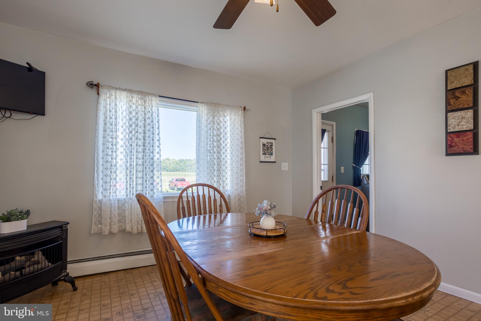 10380 Chapel Road Easton, MD 21601 - Photo 24 of 95 a dining room with furniture and wooden floor