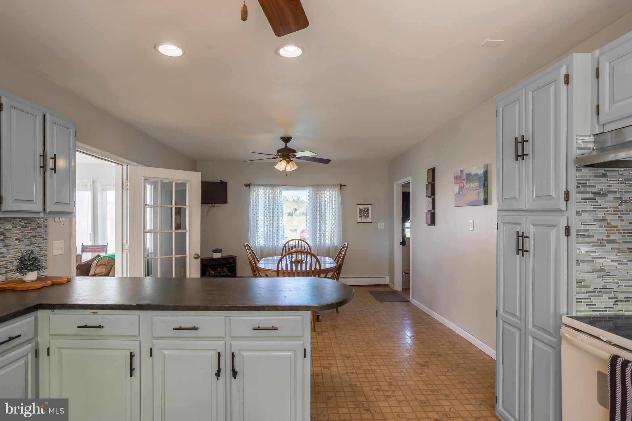 10380 Chapel Road Easton, MD 21601 - Photo 29 of 95 a kitchen with stainless steel appliances granite countertop a sink a stove and a refrigerator