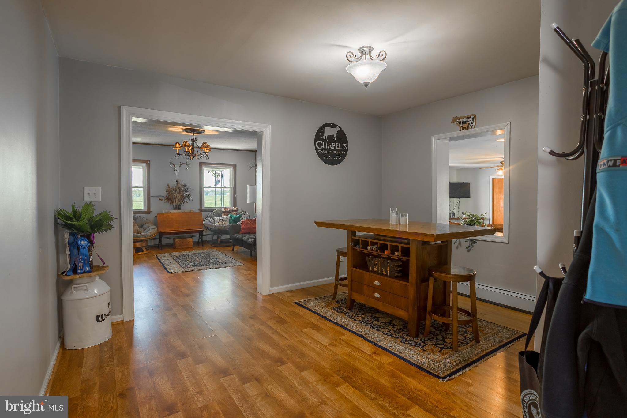 10380 Chapel Road Easton, MD 21601 - Photo 30 of 95 a living room with furniture and a wooden floor