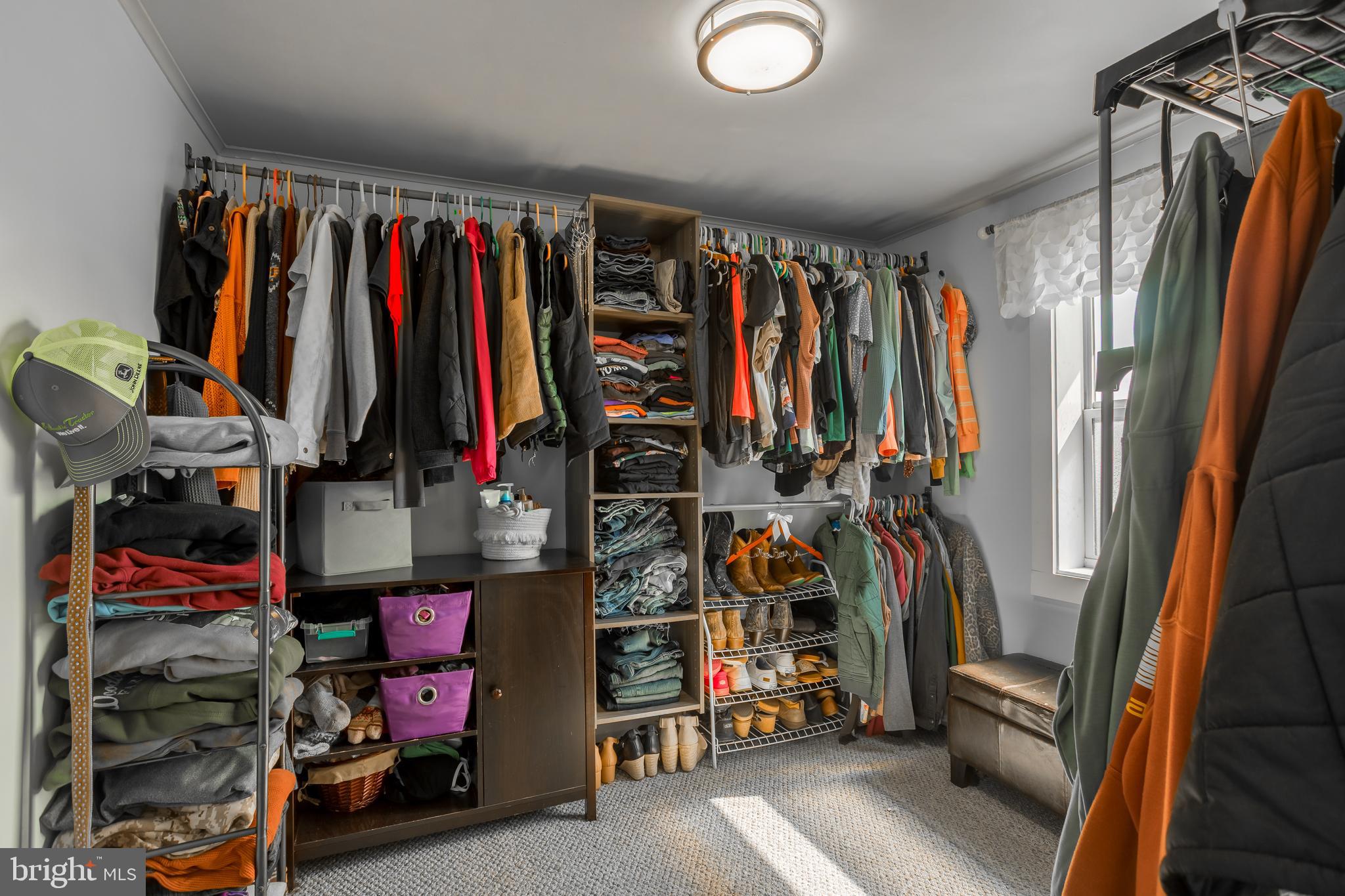 10380 Chapel Road Easton, MD 21601 - Photo 47 of 95 a view of walk in closet with clothes and shoes