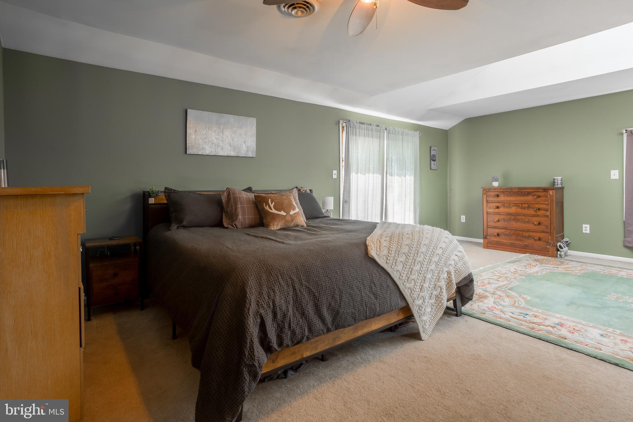 10380 Chapel Road Easton, MD 21601 - Photo 48 of 95 a bedroom with a bed and dresser