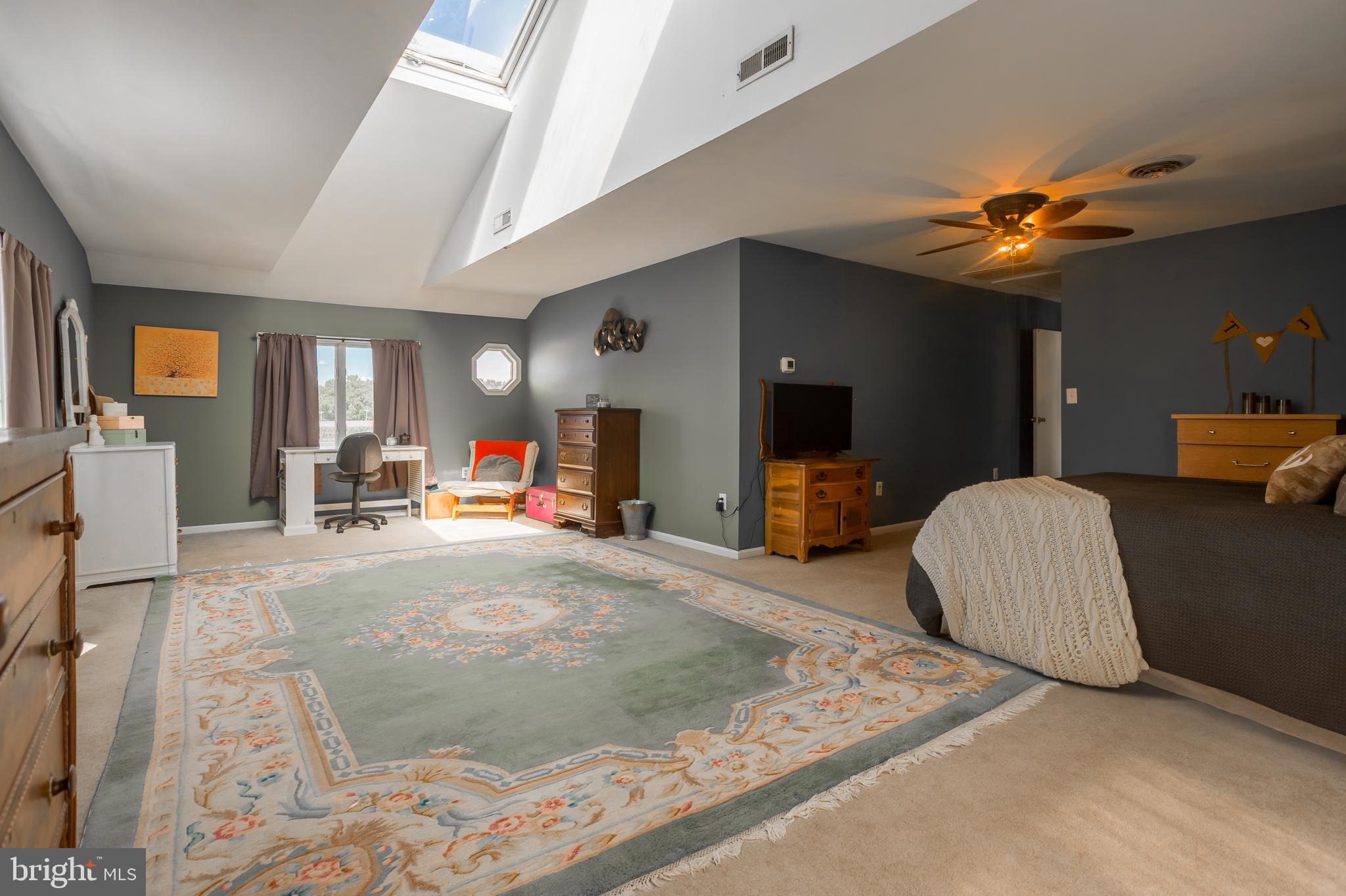 10380 Chapel Road Easton, MD 21601 - Photo 49 of 95 a living room with furniture and a flat screen tv