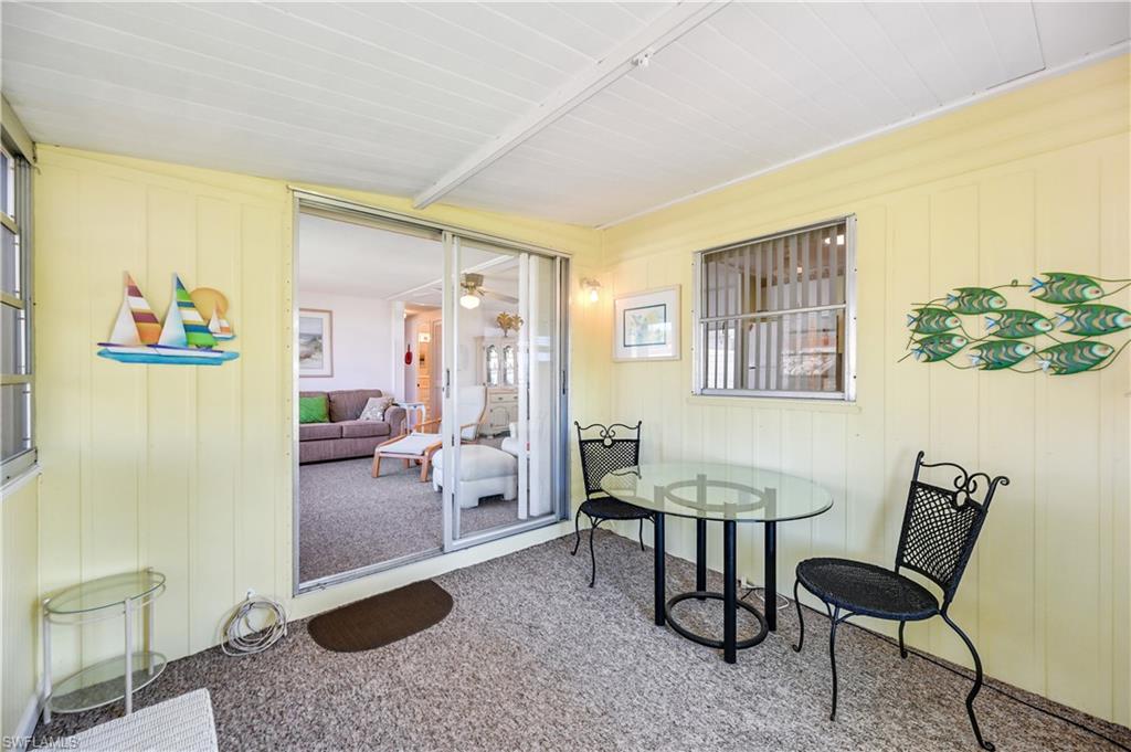 11 Moonstone Circle Naples, FL 34112 - Photo 12 of 20 a view of a livingroom with furniture and a potted plant