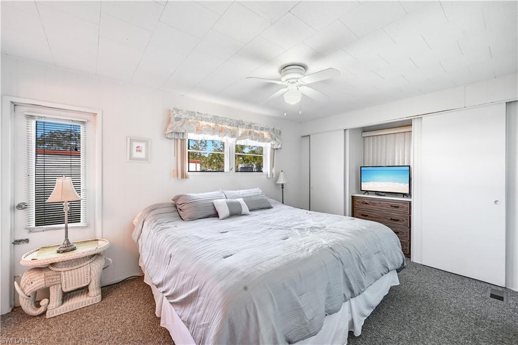 11 Moonstone Circle Naples, FL 34112 - Photo 13 of 20 a bedroom with a bed and a window